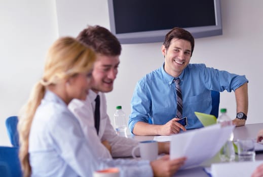 Group of happy young  business people in a meeting at office