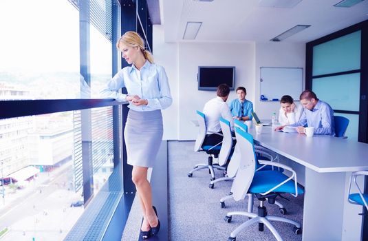 business woman  with her staff,  people group in background at modern bright office indoors