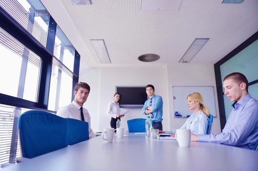 Group of happy young  business people in a meeting at office