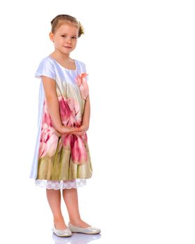 Portrait of a trendy little girl on a white background. The concept of photo for the cover of the magazine, stylish children's clothing. Isolated.