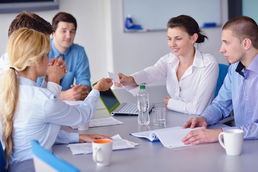 Group of happy young  business people in a meeting at office