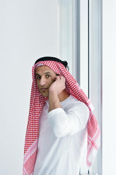 happy young arabic business man working at bright office