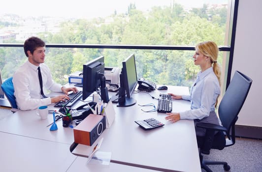 Group of happy young  business people in a meeting at office