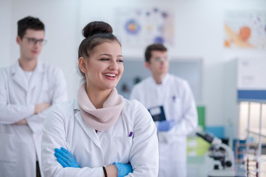 portrait of a group young medical students standing together in chemistry laboratory,teamwork by college student indoors