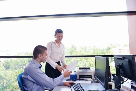 Group of happy young  business people in a meeting at office