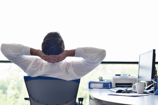 happy young business  man work in modern office on computer