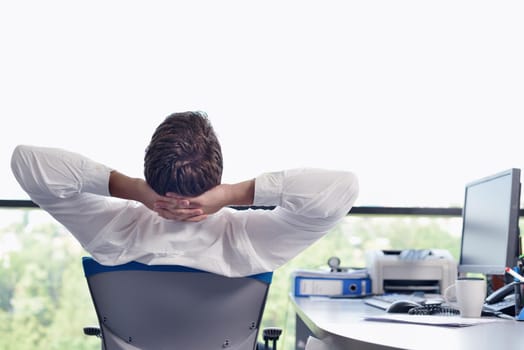 happy young business  man work in modern office on computer