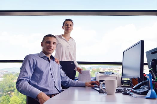 Group of happy young  business people in a meeting at office