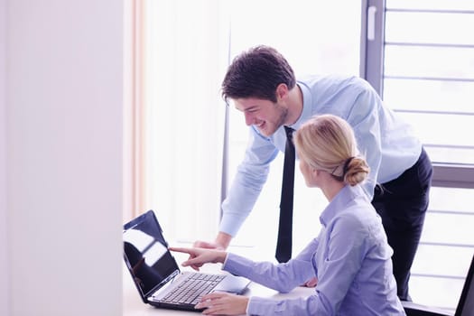 Group of happy young  business people in a meeting at office