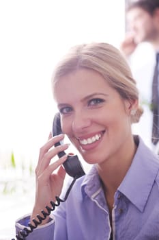 Portrait of a beautiful business woman talk by phone