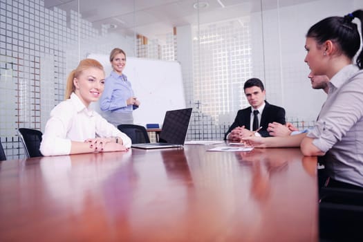 Group of happy young  business people in a meeting at office