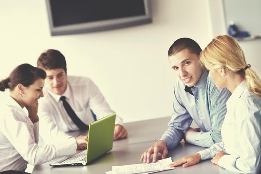 Group of happy young  business people in a meeting at office