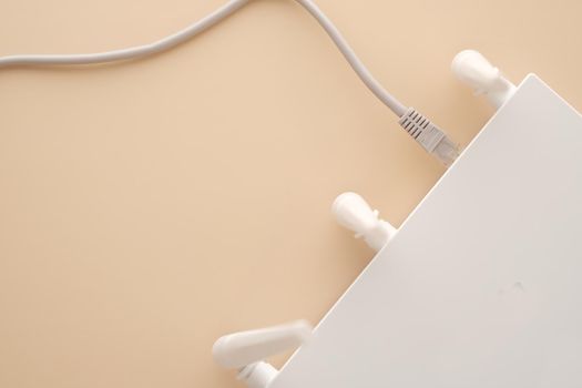 Wi-Fi router with cables on table .