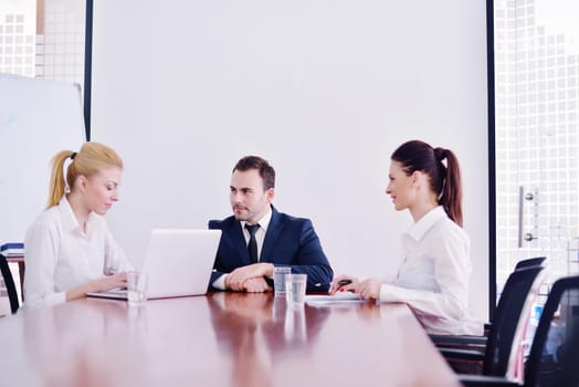 Group of happy young  business people in a meeting at office