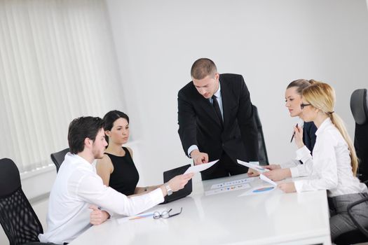 Group of happy young  business people in a meeting at office