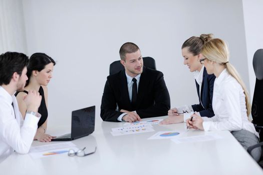 Group of happy young  business people in a meeting at office