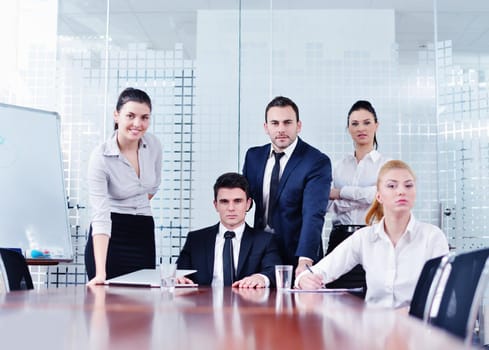 Group of happy young  business people in a meeting at office