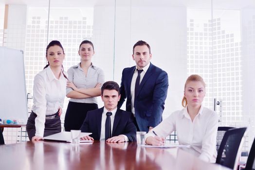 Group of happy young  business people in a meeting at office