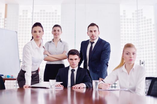 Group of happy young  business people in a meeting at office