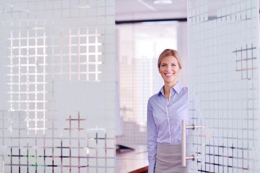 business woman  with her staff,  people group in background at modern bright office indoors