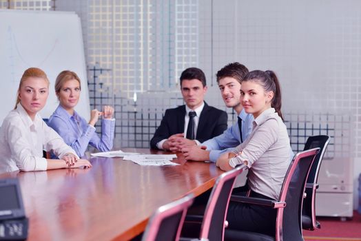 Group of happy young  business people in a meeting at office