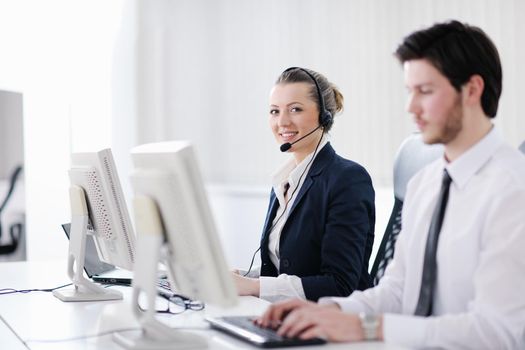 business people group with  headphones giving support in  help desk office to customers, manager giving training and education instructions