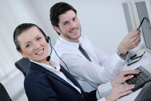 business people group with  headphones giving support in  help desk office to customers, manager giving training and education instructions