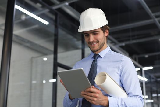 Shot of a engineer using a digital tablet on a construction site