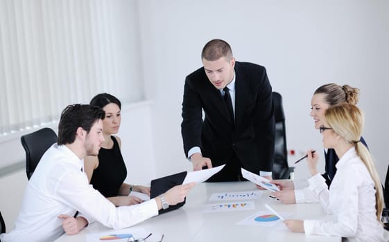 Group of happy young  business people in a meeting at office