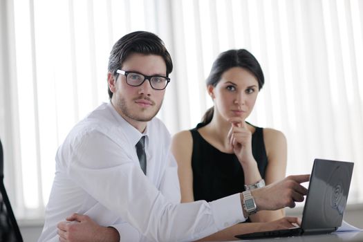 Group of happy young  business people in a meeting at office