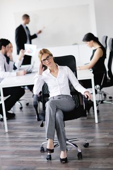 business woman  with her staff,  people group in background at modern bright office indoors