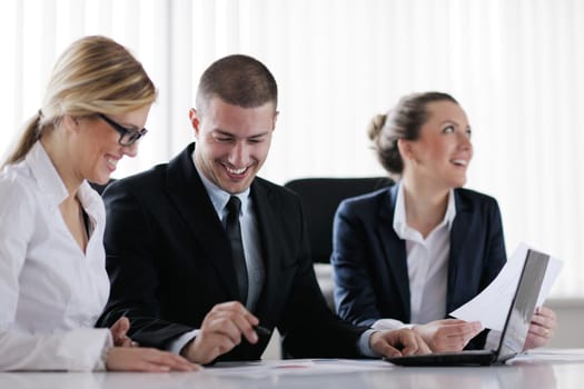 Group of happy young  business people in a meeting at office