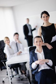 business woman  with her staff,  people group in background at modern bright office indoors