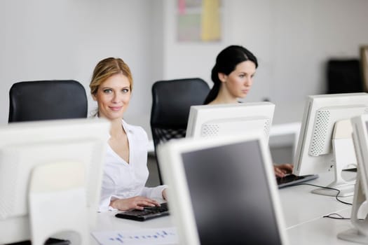 business people group with  headphones giving support in  help desk office to customers, manager giving training and education instructions