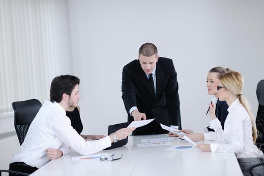 Group of happy young  business people in a meeting at office