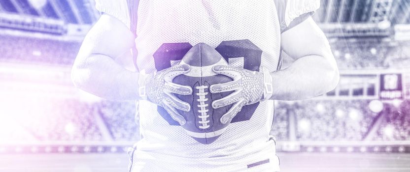 Closeup Portrait of a strong muscular American Football Player on big modern stadium field with lights and flares