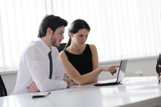 Group of happy young  business people in a meeting at office