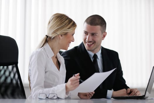 Group of happy young  business people in a meeting at office