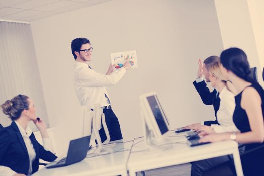 business people group with  headphones giving support in  help desk office to customers, manager giving training and education instructions