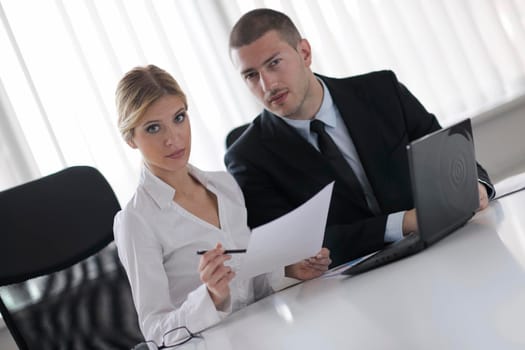 Group of happy young  business people in a meeting at office