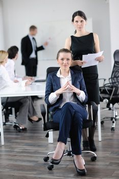 business woman  with her staff,  people group in background at modern bright office indoors