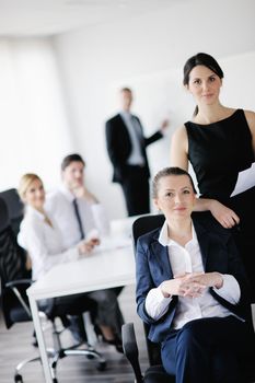 business woman  with her staff,  people group in background at modern bright office indoors