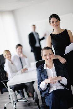 business woman  with her staff,  people group in background at modern bright office indoors