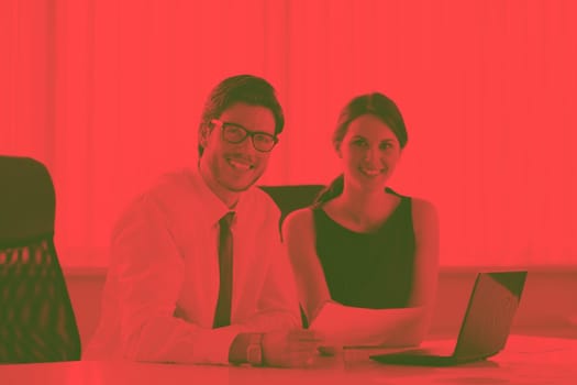 Group of happy young  business people in a meeting at office