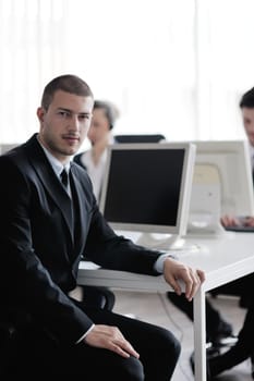 business people group with  headphones giving support in  help desk office to customers, manager giving training and education instructions