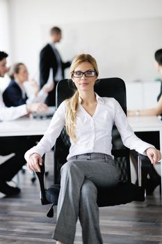 business woman  with her staff,  people group in background at modern bright office indoors