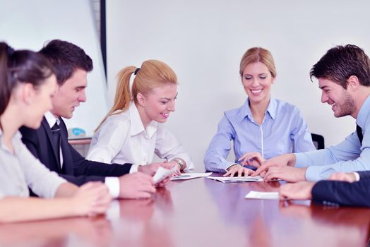 Group of happy young  business people in a meeting at office