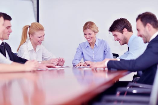 Group of happy young  business people in a meeting at office