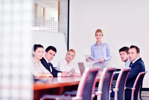 Group of happy young  business people in a meeting at office