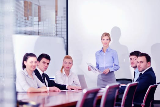 Group of happy young  business people in a meeting at office